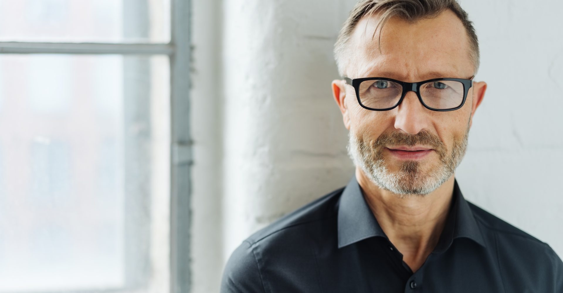Bearded,middle Aged,man,wearing,glasses,looking,at,camera,with,a